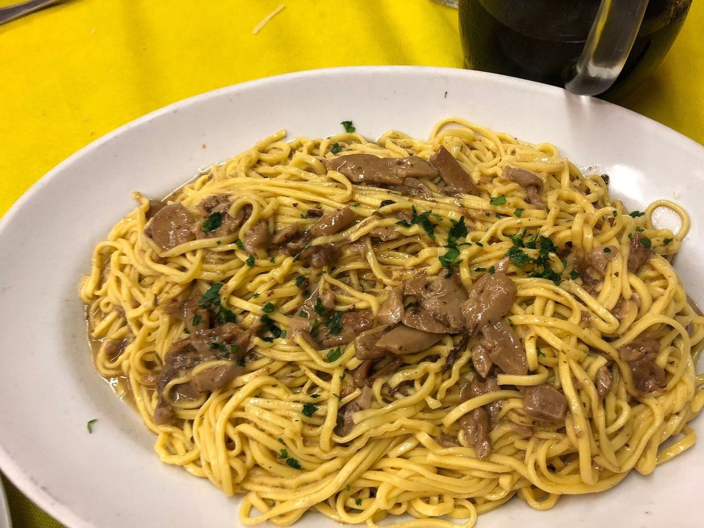 A plate of tagliolini with porcini mushrooms